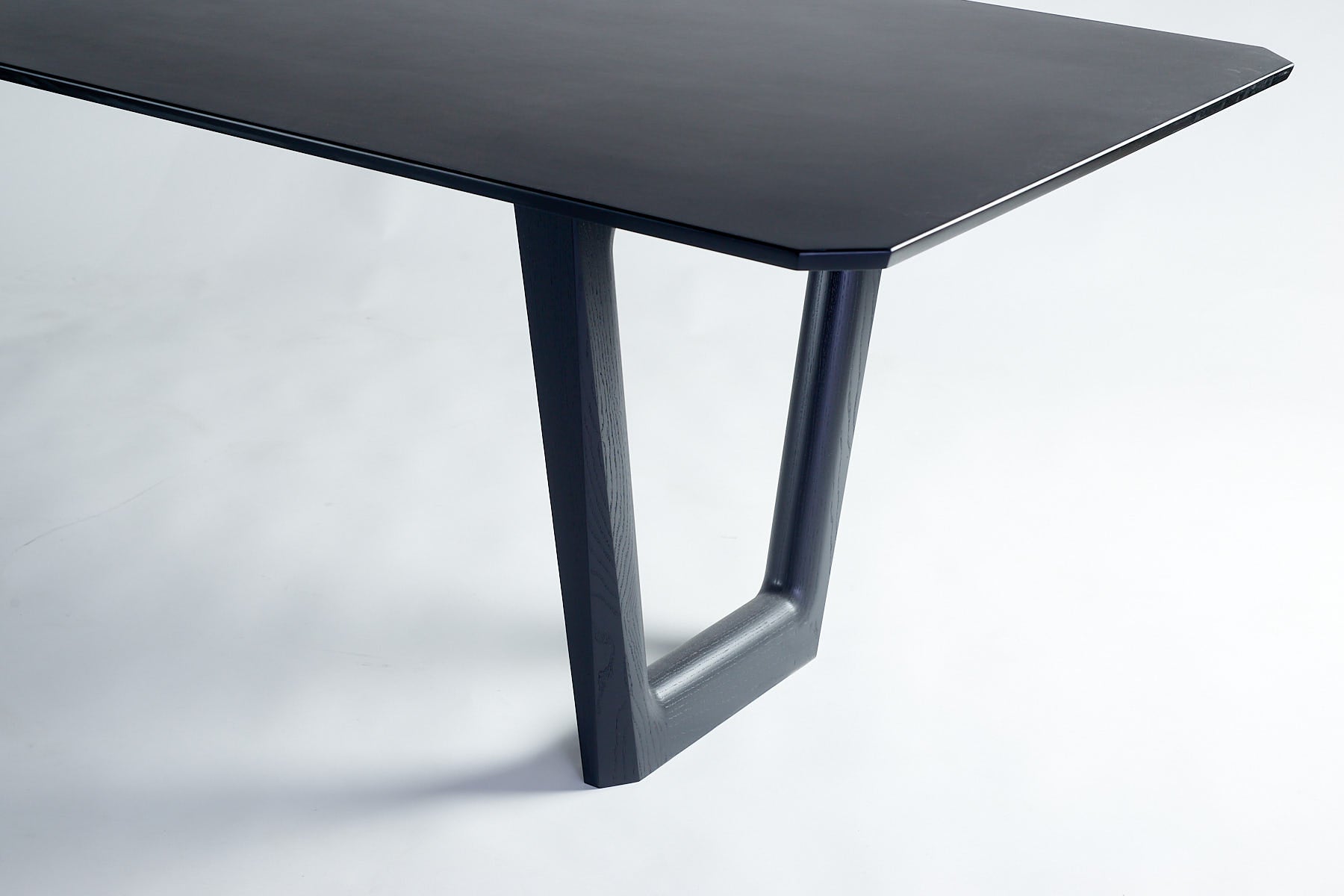 Dapto Dining Table Black Ash and Black Richlite -leg detail quarter view